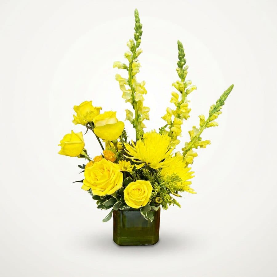 After: yellow roses and snapdragons in a cube vase, BloomShot product photo