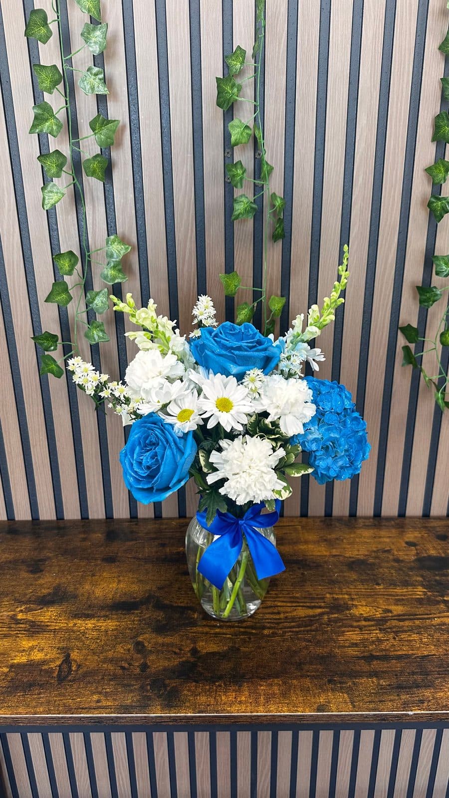 Before: blue and white vase arrangement, photographed in the shop